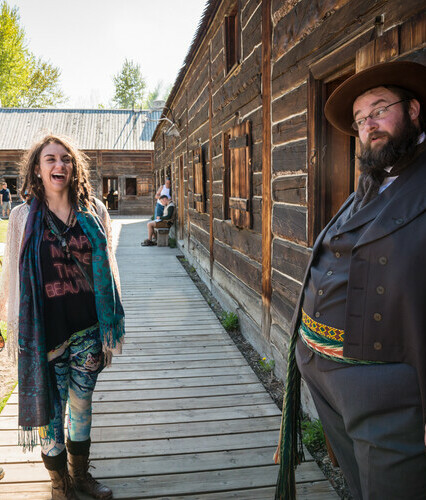 Costumed interpreter greeting visitors to the Fort